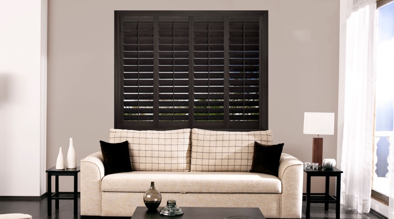 Houston sitting room with black shutters.